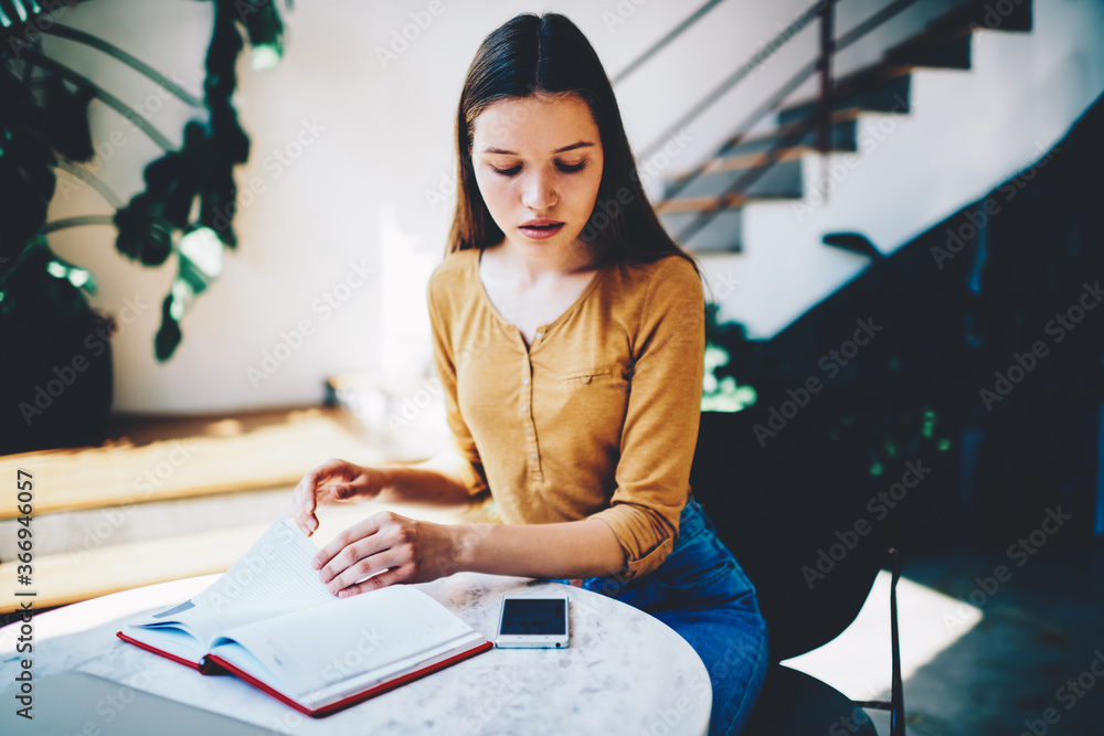 Aufkleber thoughtful hipster girl turning blank pages in notepad searching to do list while getting message on