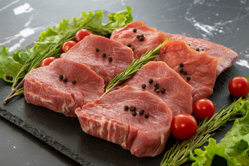 raw meat on a black background