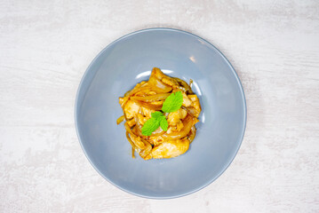 wok fried chicken stir fry with sweet peppers and chinese vegetables