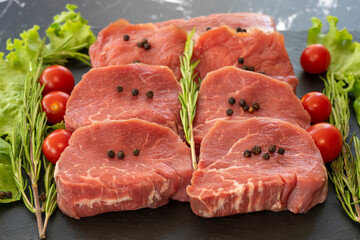 raw meat on a black background