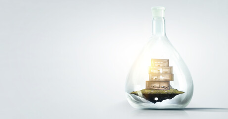 House and grass inside a glass bottle