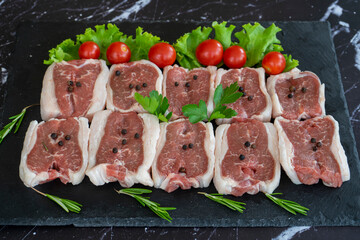 raw meat on a black background