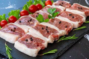 raw meat on a black background