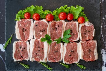 raw meat on a black background