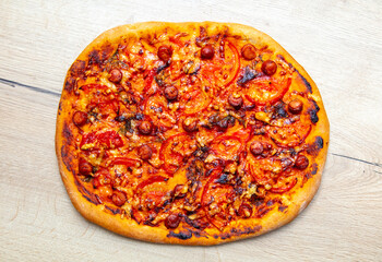 Pizza with tomatoes and sausage