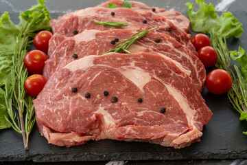 raw meat on a black background