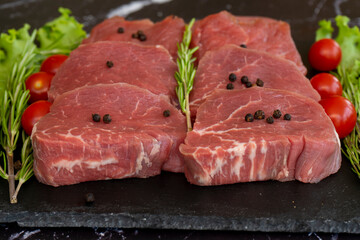 raw meat on a black background
