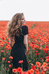 Beautiful happy blondie woman natural face blondie hair casual female portrait in red poppy field