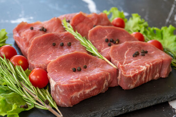 raw meat on a black background