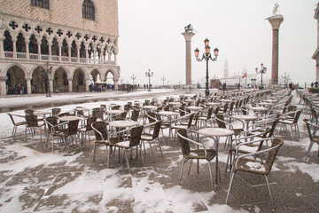 Fototapeta na wymiar Venice, Italy - March 01, 2018: Snow on Piazza San Marco - St Mark's Square in Venice