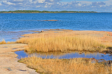 Aland archipelago consists of nearly three hundred habitable islands, some 6,000 skerries and desolate rocks. Picturesque landscape of rocky coast