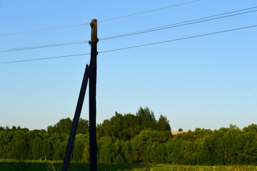 pole with wires against the sky