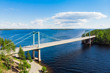 Aerial view of Karisalmi bridge on Pulkkilanharju Ridge at lake Paijanne, Paijanne National Park, Finland.