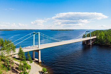 Obraz premium Aerial view of Karisalmi bridge on Pulkkilanharju Ridge at lake Paijanne, Paijanne National Park, Finland.