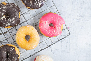 .Donuts on a white wood background