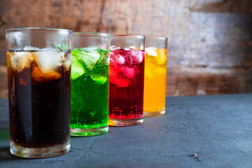 Fototapeta na wymiar Soft drinks in the glass on the table