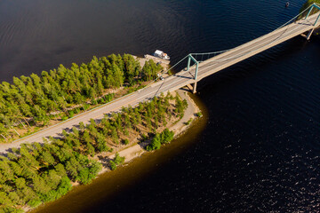 Aerial view of Karisalmi bridge on Pulkkilanharju Ridge at lake Paijanne, Paijanne National Park, Finland.