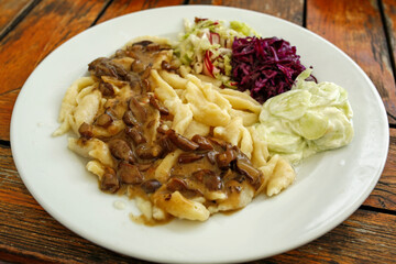 vegetarian meal, homemade noodles with mushroom saucea and fresh salads