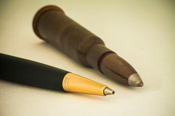 A Pen and Bullets symbol of press on war. Hybrid wars