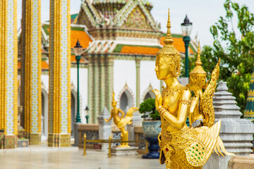 Close up a golden fairytale creature statue inside Wat Phra Kaew, Temple of the Emerald Buddha Wat Phra Kaew is one of the most famous places in Bangkok, Thailand