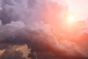 Heaven. Epic Dramatic dark storm cumulus clouds with yellow orange sun and sunlight