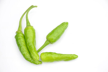 the green ripe chilly isolated on white background.