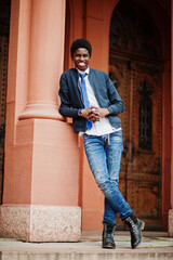 African man wear in tie and casual outfit posing outdoor.