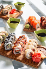 sushi on a wooden board with soy sauce