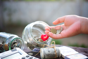 hand holding a jar of pills