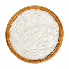 Baking powder in wooden bowl. White, dry chemical leavening agent. Mixture of carbonate or bicarbonate and weak acid. With cornstarch to prevent from reacting prematurely. Close-up, from above, photo.