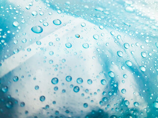 Water droplets on the blue background abstract texture