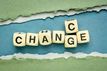 change and chance - word abstract in wooden cubes against handmade paper, opportunity in changing...