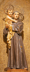 BARCELONA, SPAIN - MARCH 3, 2020: The carved polychrome statue of St. Anthony of Pauda in the church Iglesia Santa Maria de Gracia de Jesus.