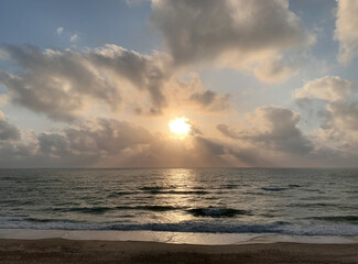 fading beach sunset at summer days, colored background 