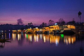 Obraz premium Illuminated Houseboats parked on the bank of Dal Lake in Srinaga
