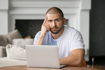 cute man working on a laptop