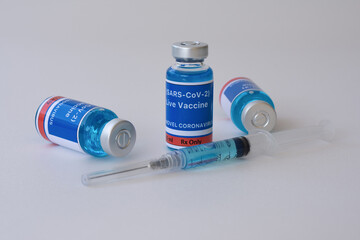 Vaccine and syringe for vaccination. Live vaccine for the SARS-CoV-2 concept.