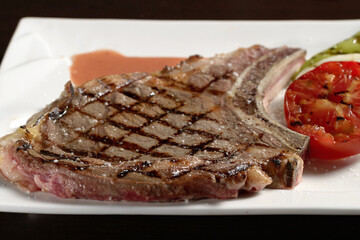 Cowboy beef steak with grilled vegetables close-up. Photos for restaurant and cafe menus