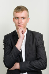 Portrait of young businessman with blond hair