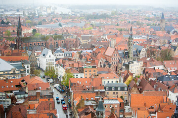 Fototapeta na wymiar Bruges, Belgium; A high angle view of the crowded buildings in the city of Bruges.