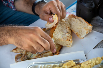 Close up man eating fish