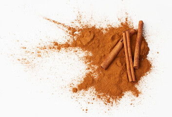 Cinnamon sticks on white background, place for text