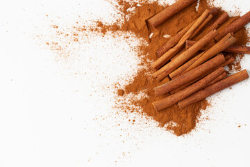 Background image of a cinnamon stick and a pile of ground cinnamon