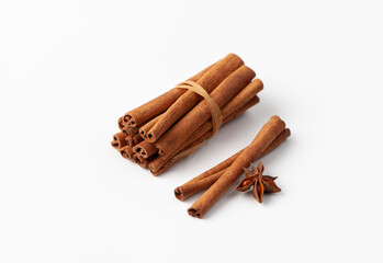 Cinnamon sticks on white background, place for text