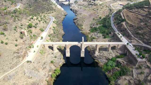 Aeria view of old bridge and beautiful landscape in a sunny day. Drone Footage