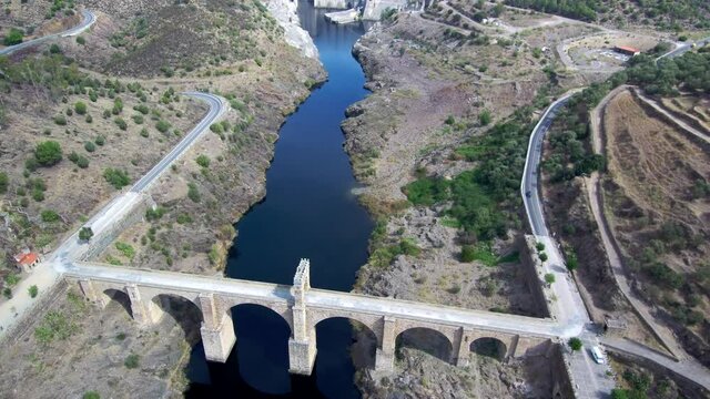 Aeria view of old bridge and beautiful landscape in a sunny day. Drone Footage