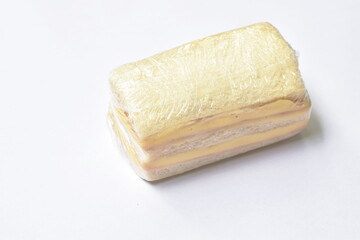 sandwich stuffed ham and cheese packing in clear plastic on white background