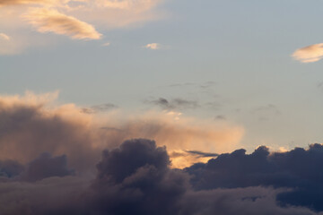 Sunset. Dark blue clouds. Heaven. Natural background.