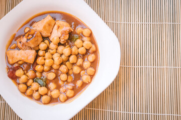 Mediterranean food concept. Food plate with chickpeas, vegetables and chicken pieces