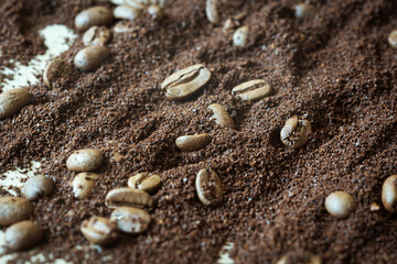 a scattering of ground coffee and coffee beans